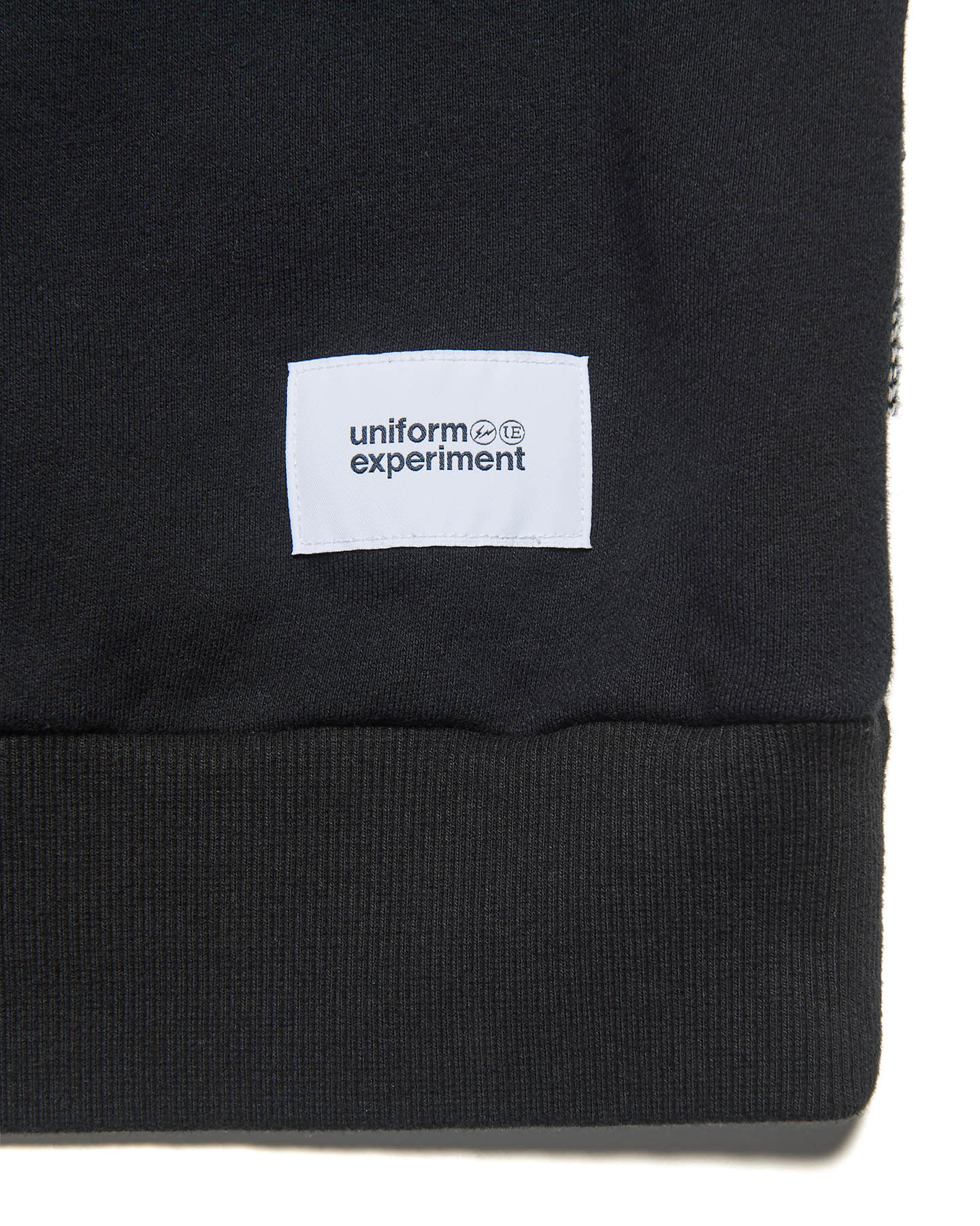 uniform experiment / LINE FLANNEL CHECK PANELED CREWNECK TOP (BLACK)タグ